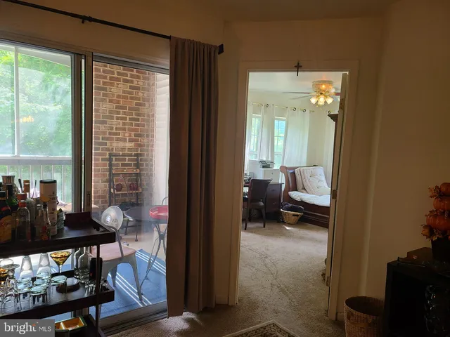 a view of a livingroom with furniture and windows