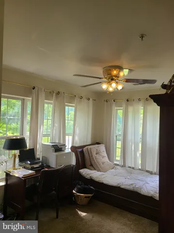 a view of a livingroom with furniture and window