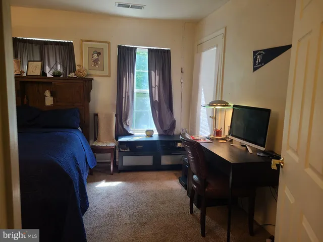 a view of workspace with furniture and window