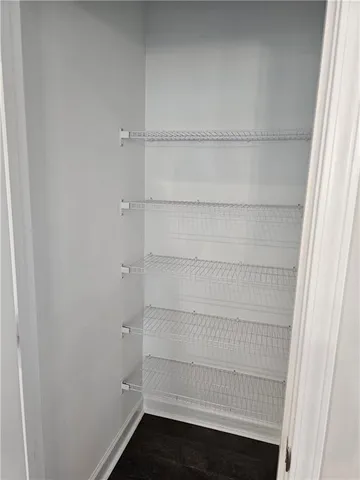 a bathroom with a sink a window and a toilet