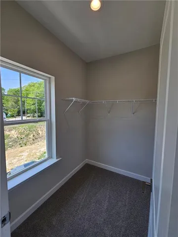 a bathroom with double sink and a mirror