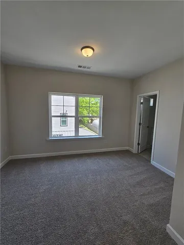a white toilet and tub sitting next to a bathroom sink