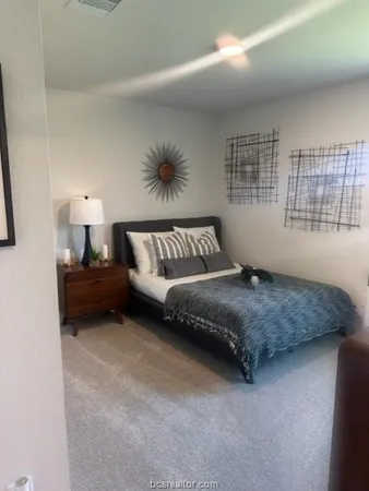 a bedroom with a bed and window