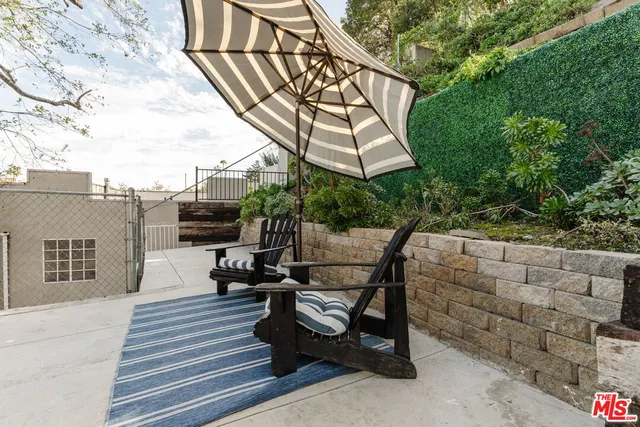 a view of a terrace with couches and pool