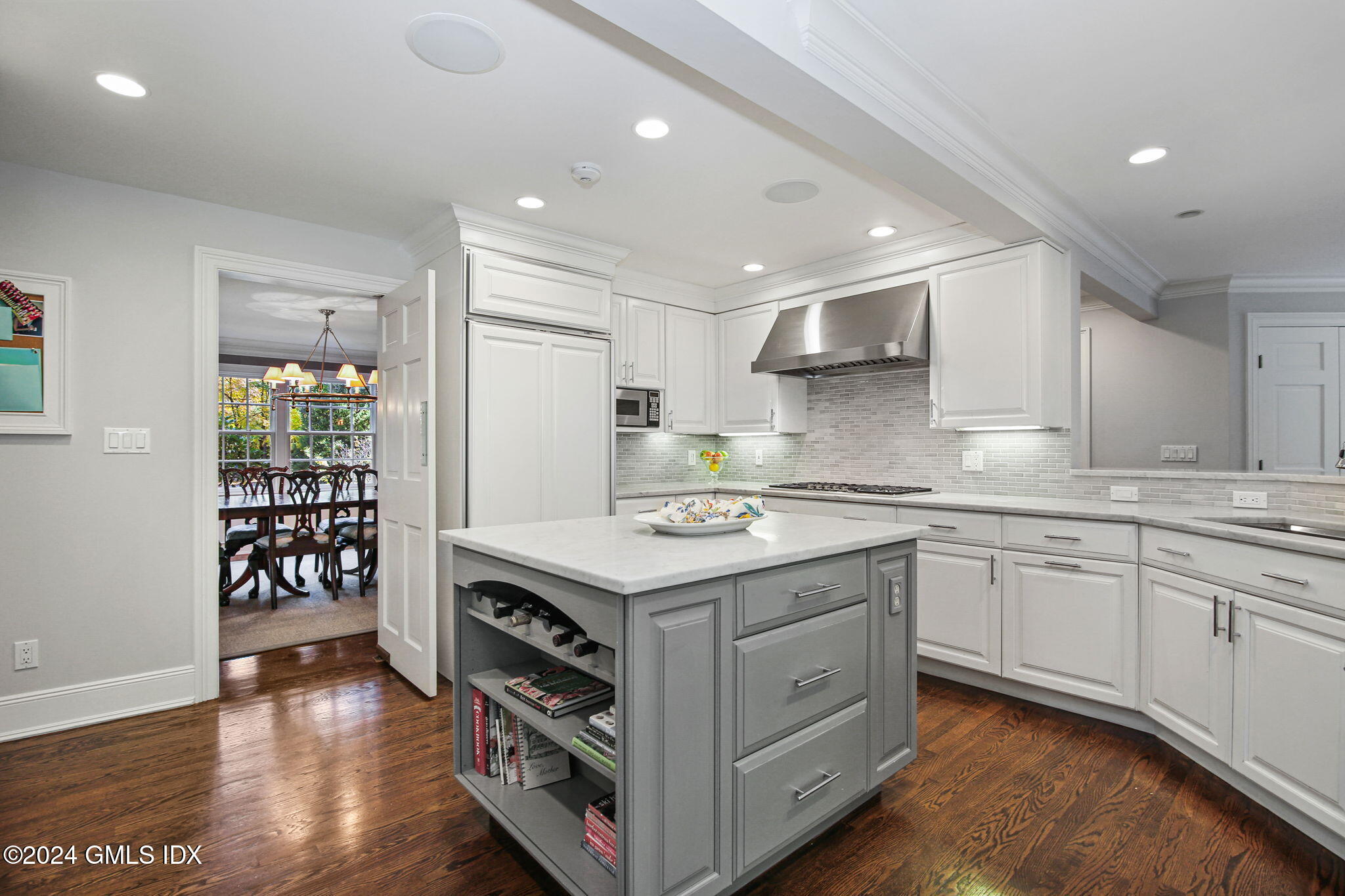 49 Grosset Road Riverside, CT 06878 - Photo 13 of 41 a kitchen that has a lot of cabinets in it and wooden floors