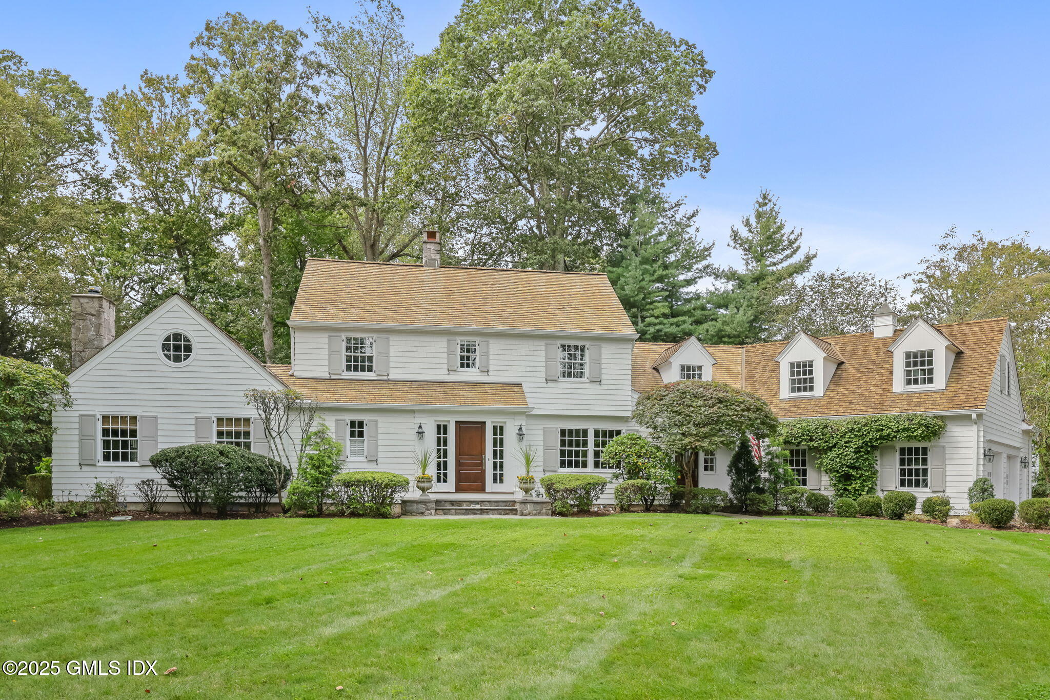49 Grosset Road Riverside, CT 06878 - Photo 2 of 41 a front view of a house with a garden