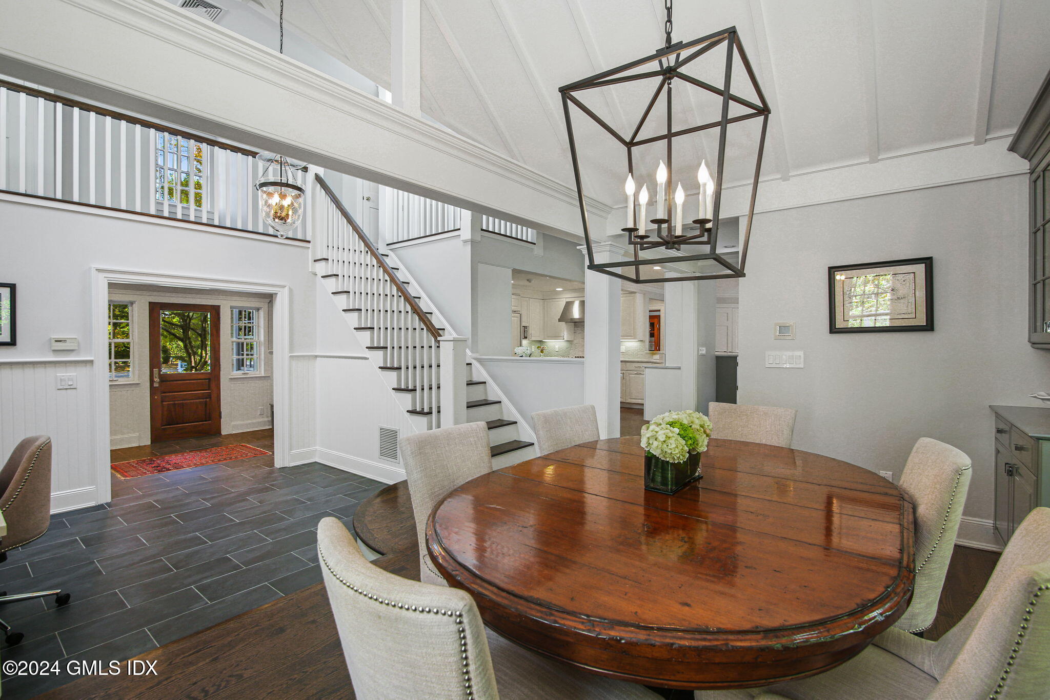 49 Grosset Road Riverside, CT 06878 - Photo 23 of 41 a view of a dining room with furniture wooden floor and chandelier