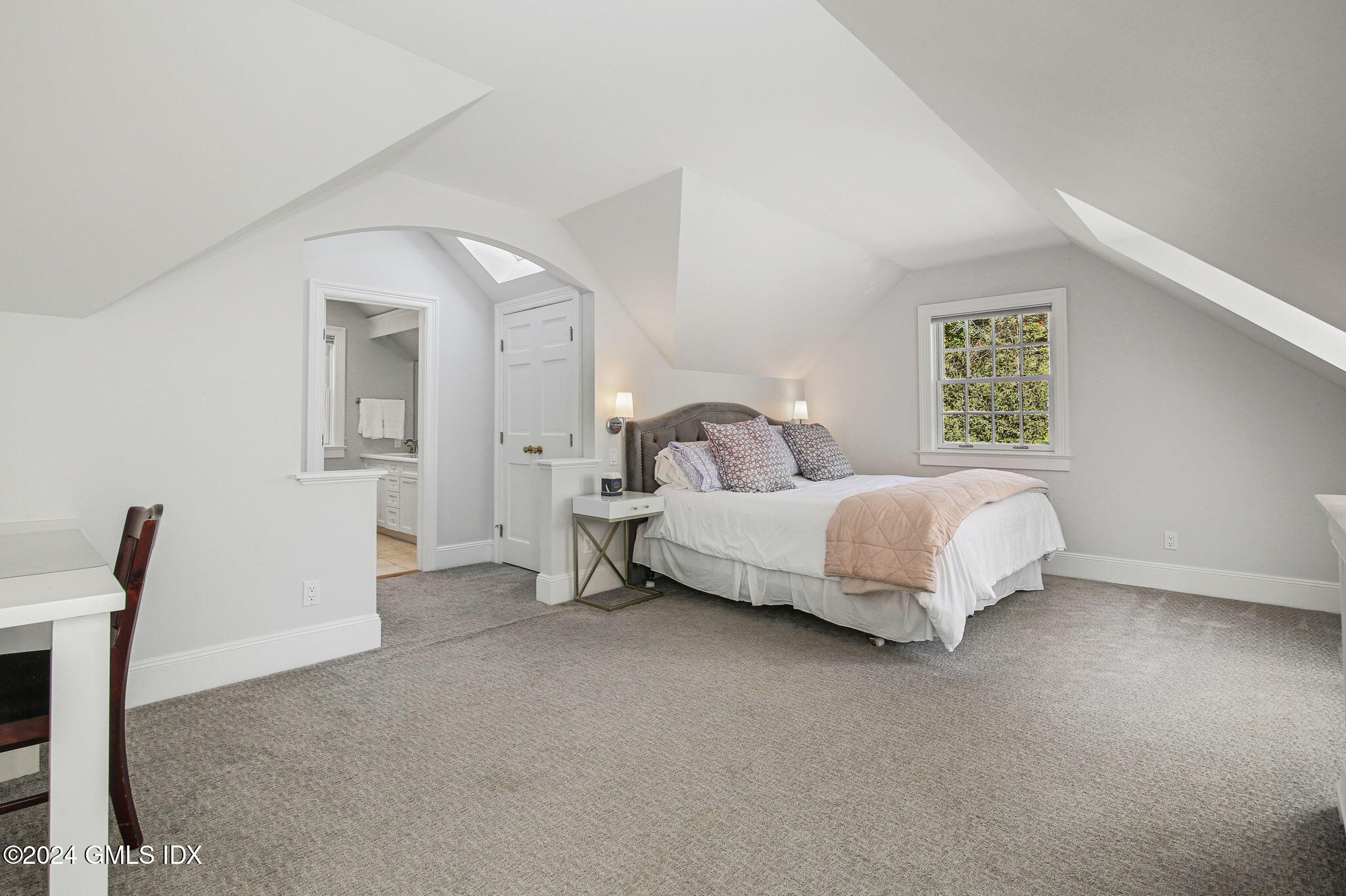 49 Grosset Road Riverside, CT 06878 - Photo 28 of 41 a bedroom with a bed and a chair