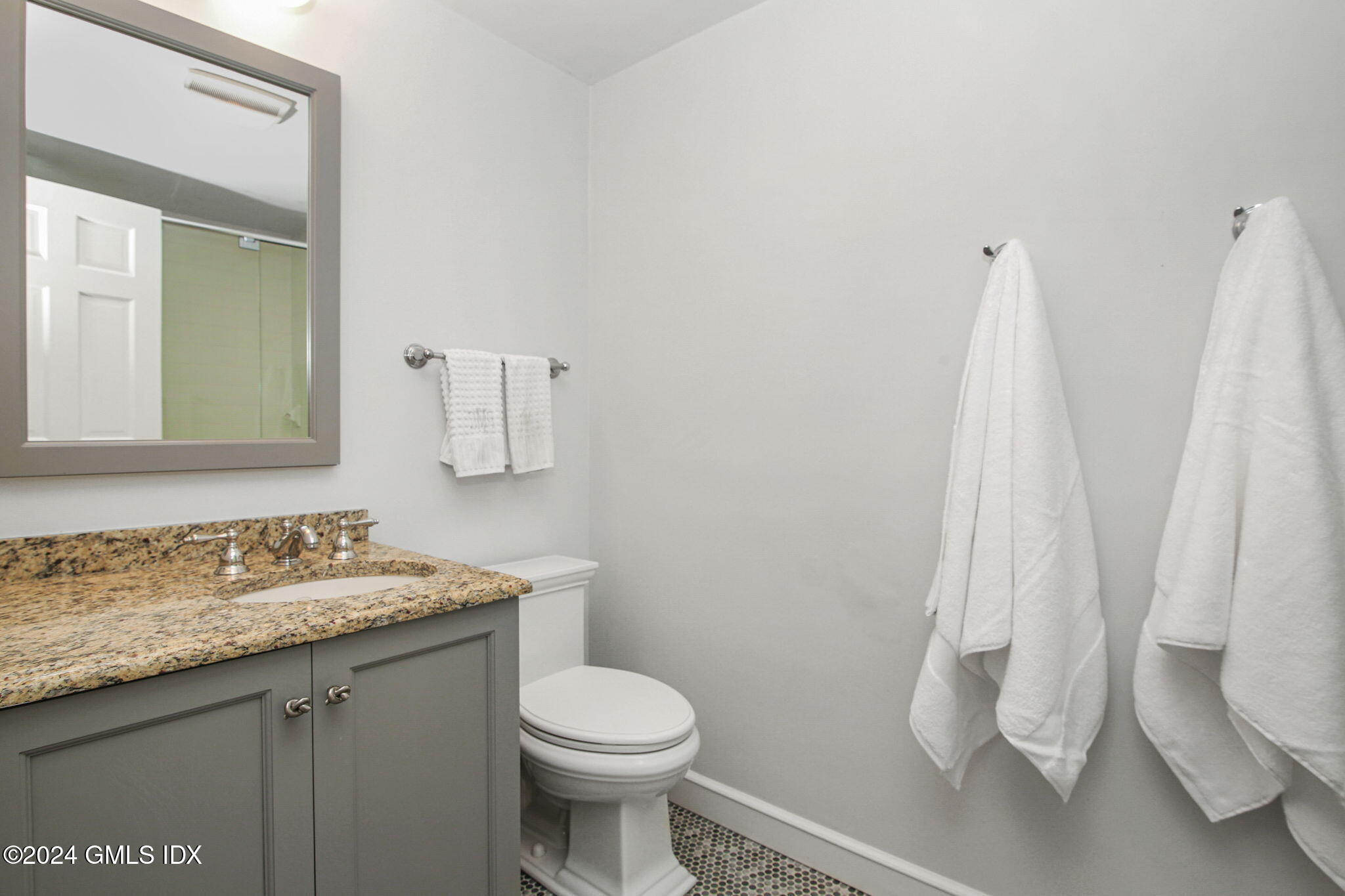 49 Grosset Road Riverside, CT 06878 - Photo 31 of 41 a bathroom with a granite countertop sink toilet and shower