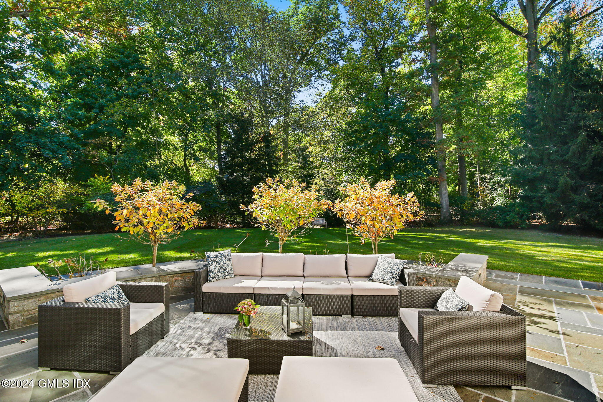 49 Grosset Road Riverside, CT 06878 - Photo 35 of 41 a view of a patio with couches chairs and a yard
