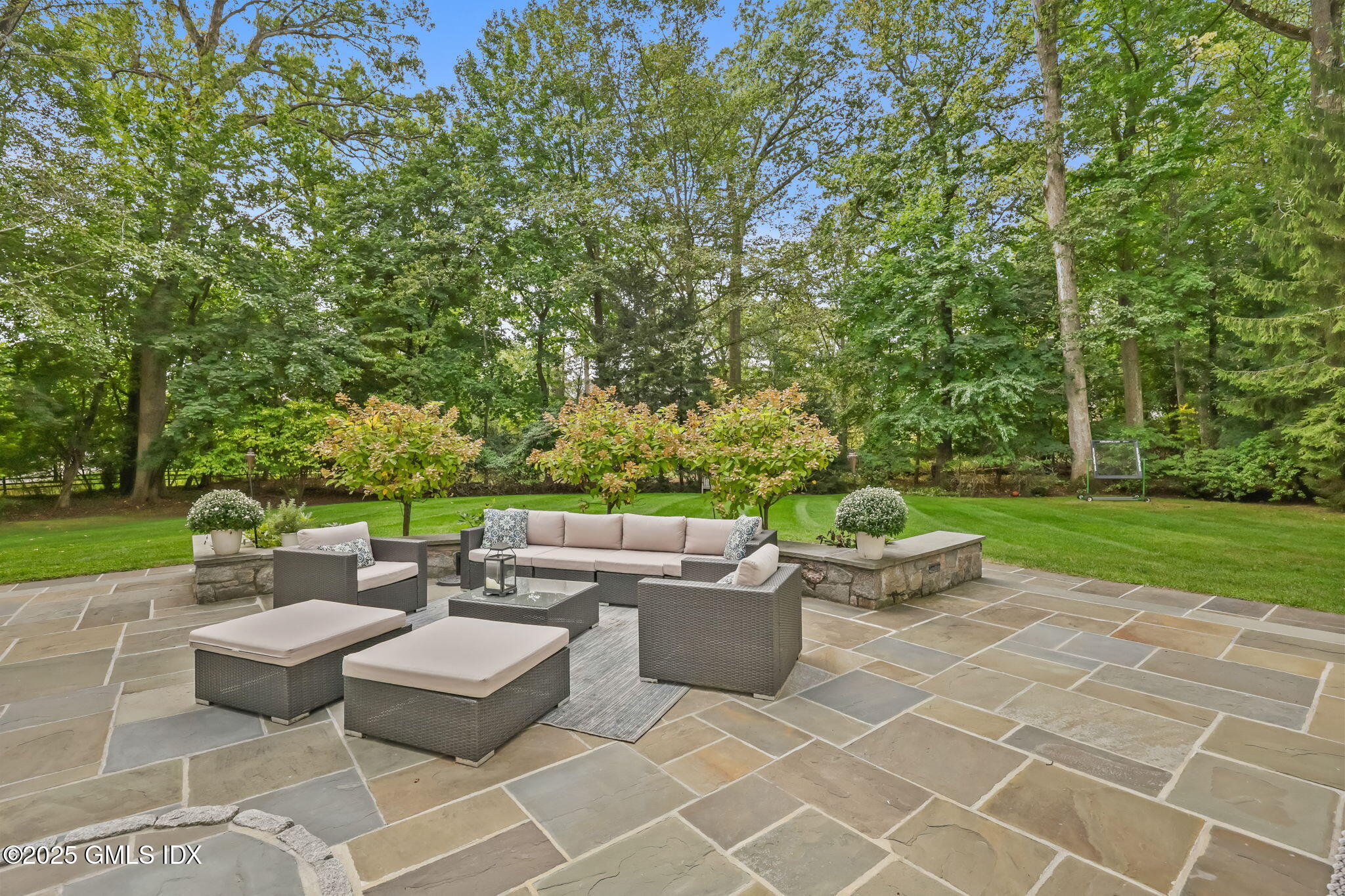 49 Grosset Road Riverside, CT 06878 - Photo 36 of 41 a patio with patio a fire pit and outdoor seating