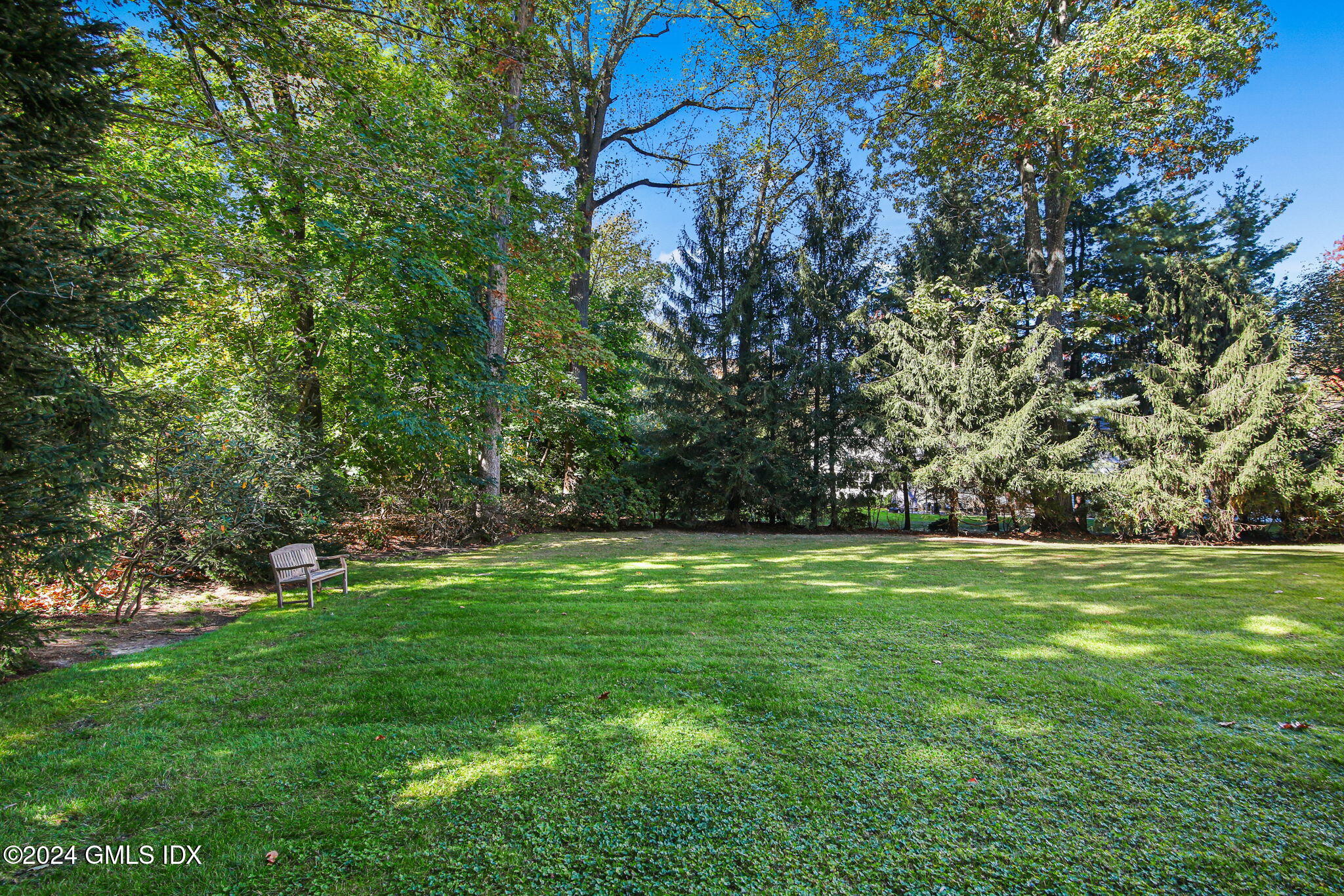 49 Grosset Road Riverside, CT 06878 - Photo 38 of 41 a backyard of a house with lots of green space