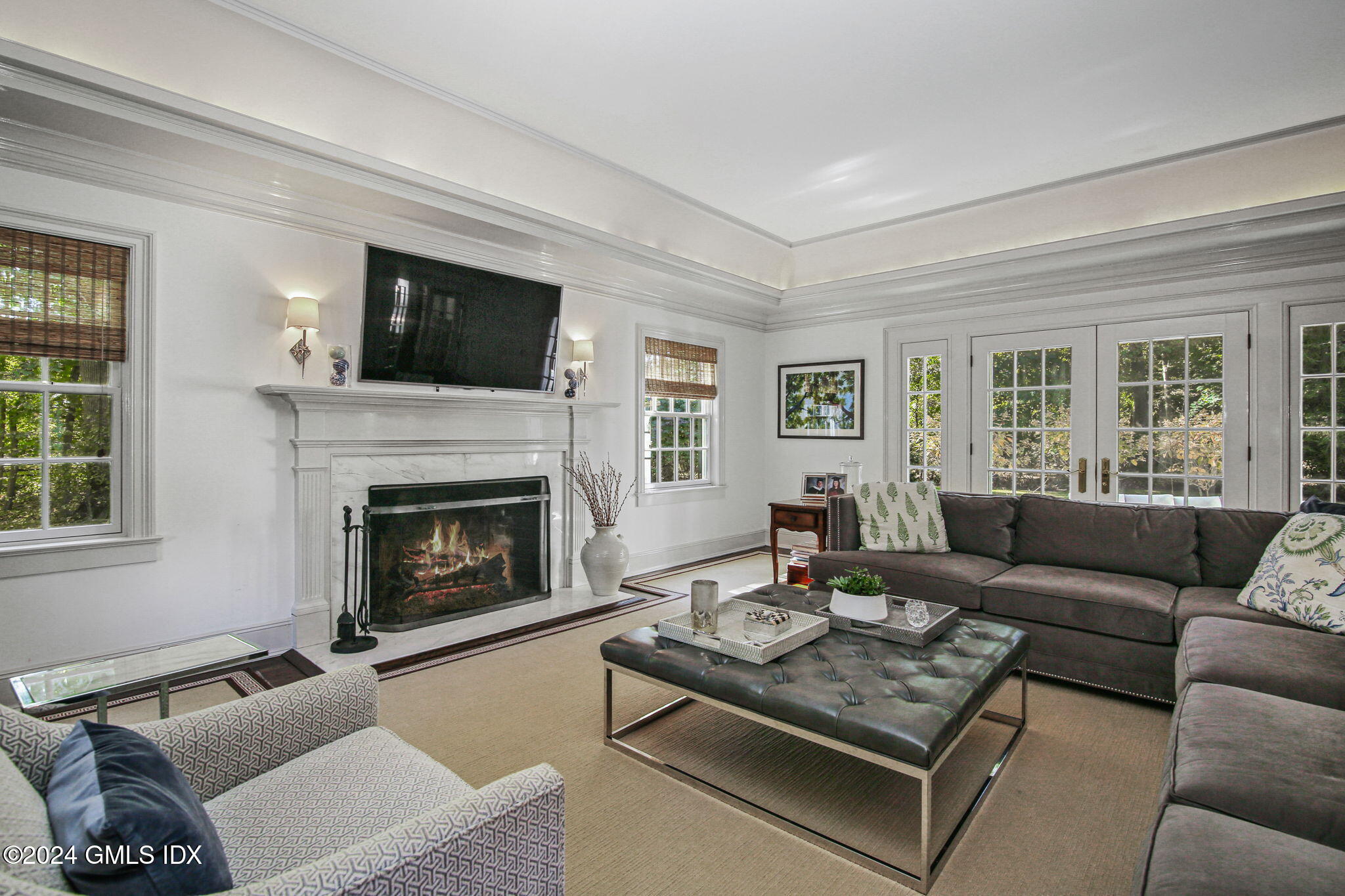 49 Grosset Road Riverside, CT 06878 - Photo 6 of 41 a living room with furniture and a fireplace