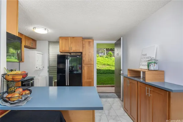 a view of a kitchen with furniture and window