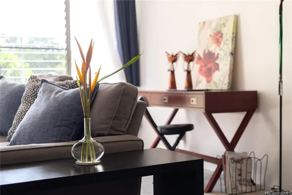 a view of a livingroom with furniture and window