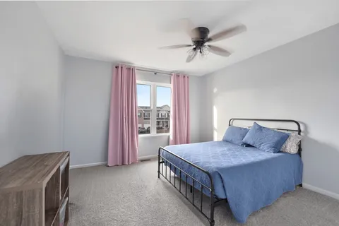 a bed room with a bed and a chandelier