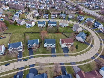 an aerial view of a house with outdoor space