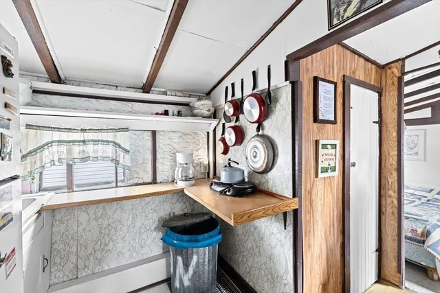 a front view of a house with entryway and outdoor seating