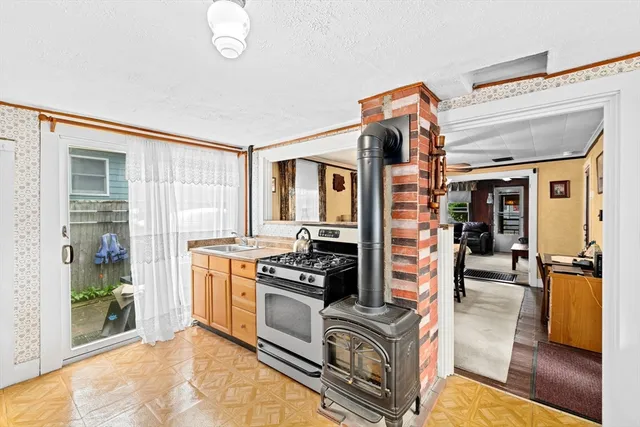 a kitchen with stainless steel appliances granite countertop a stove and a refrigerator