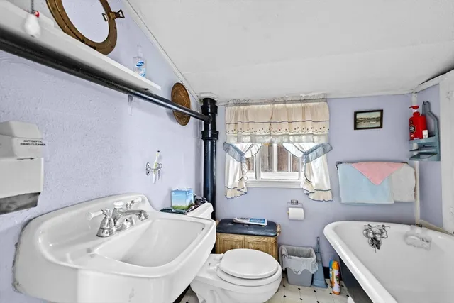 a bathroom with a sink a toilet and a bathtub