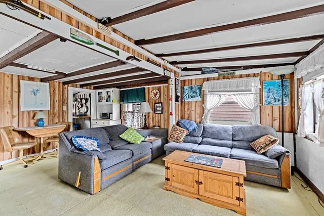 a outdoor living space with furniture and a ceiling fan