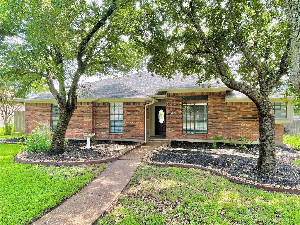 4508 Kensington Road Bryan, TX 77802 - Photo 1 of 25 Ranch-style home featuring a front lawn