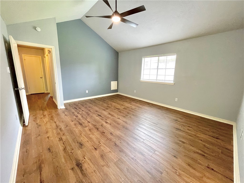 4508 Kensington Road Bryan, TX 77802 - Photo 11 of 25 Spare room featuring ceiling fan, lofted ceiling, and hardwood / wood-style floors
