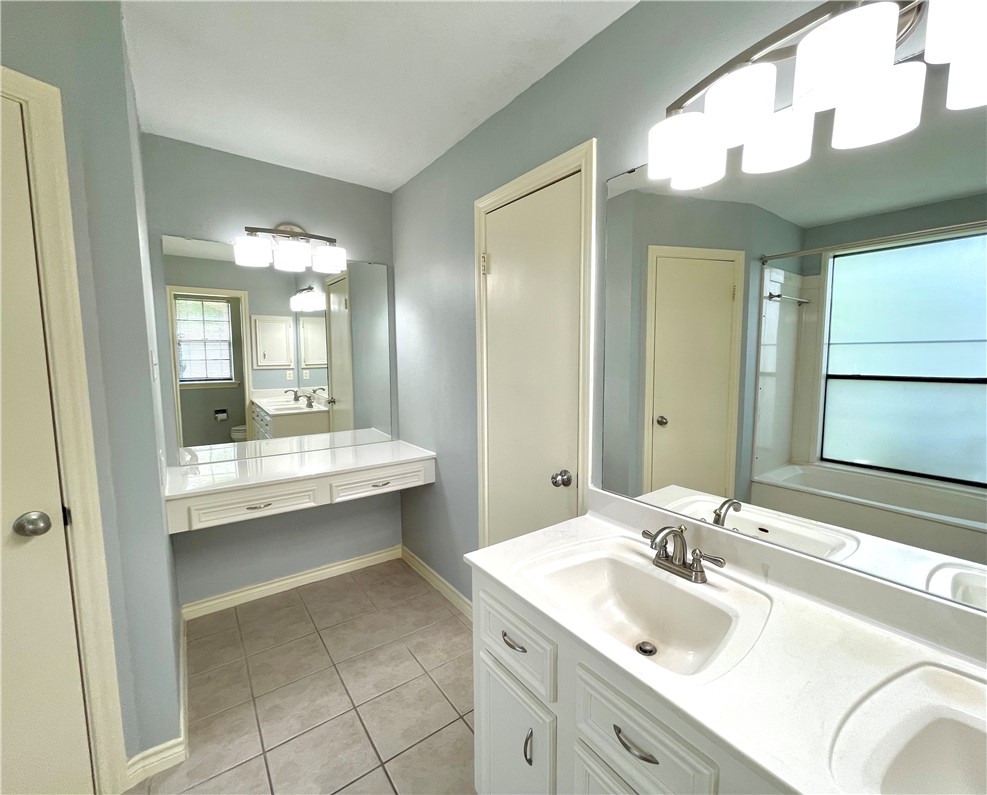4508 Kensington Road Bryan, TX 77802 - Photo 15 of 25 Bathroom with vanity and tile patterned flooring