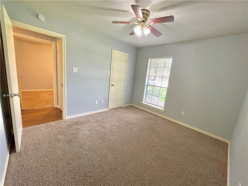 4508 Kensington Road Bryan, TX 77802 - Photo 17 of 25 Spare room with carpet floors and ceiling fan
