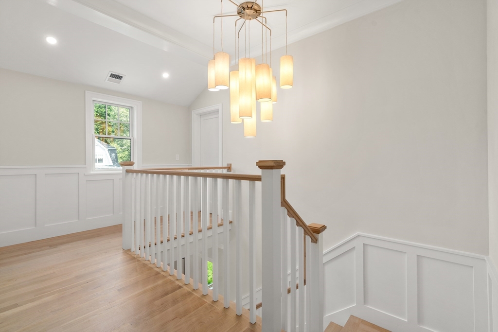 28 Parker Road Wellesley, MA 02482 - Photo 17 of 32 a view of a hallway with windows