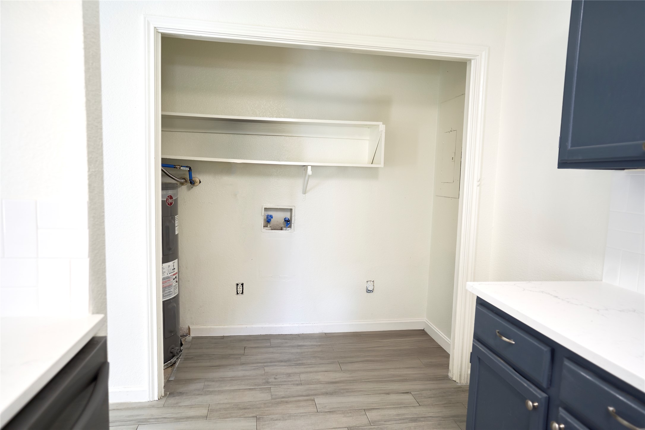 23393 Nameless Road, Unit 142 Leander, TX 78641 - Photo 10 of 15 A dedicated laundry closet provides a functional space with essential hookups and storage.