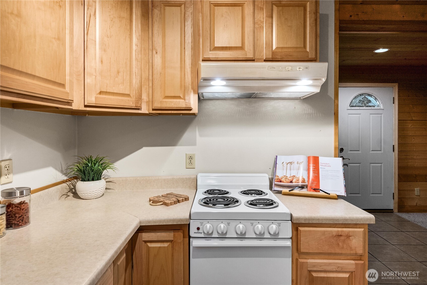 4692 Northeast Lincoln Road Poulsbo, WA 98370 - Photo 12 of 22 a kitchen with a stove and a refrigerator