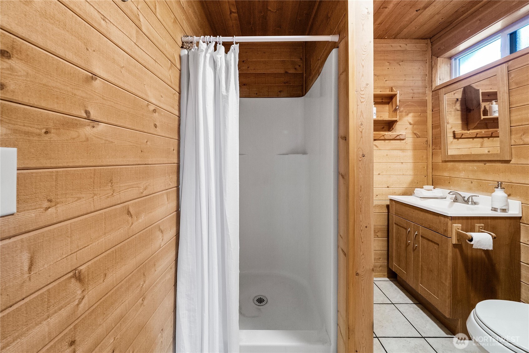 4692 Northeast Lincoln Road Poulsbo, WA 98370 - Photo 13 of 22 a bathroom with a sink and a mirror