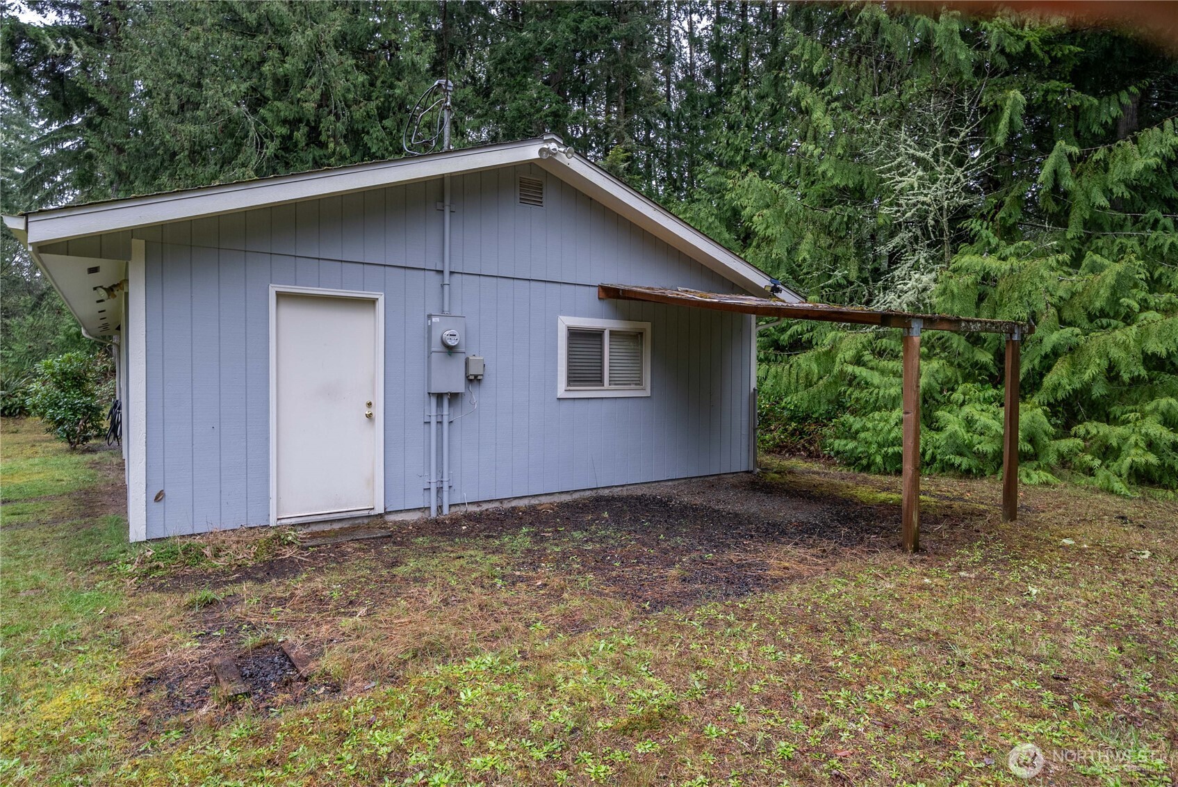 4692 Northeast Lincoln Road Poulsbo, WA 98370 - Photo 2 of 22 a house with a yard