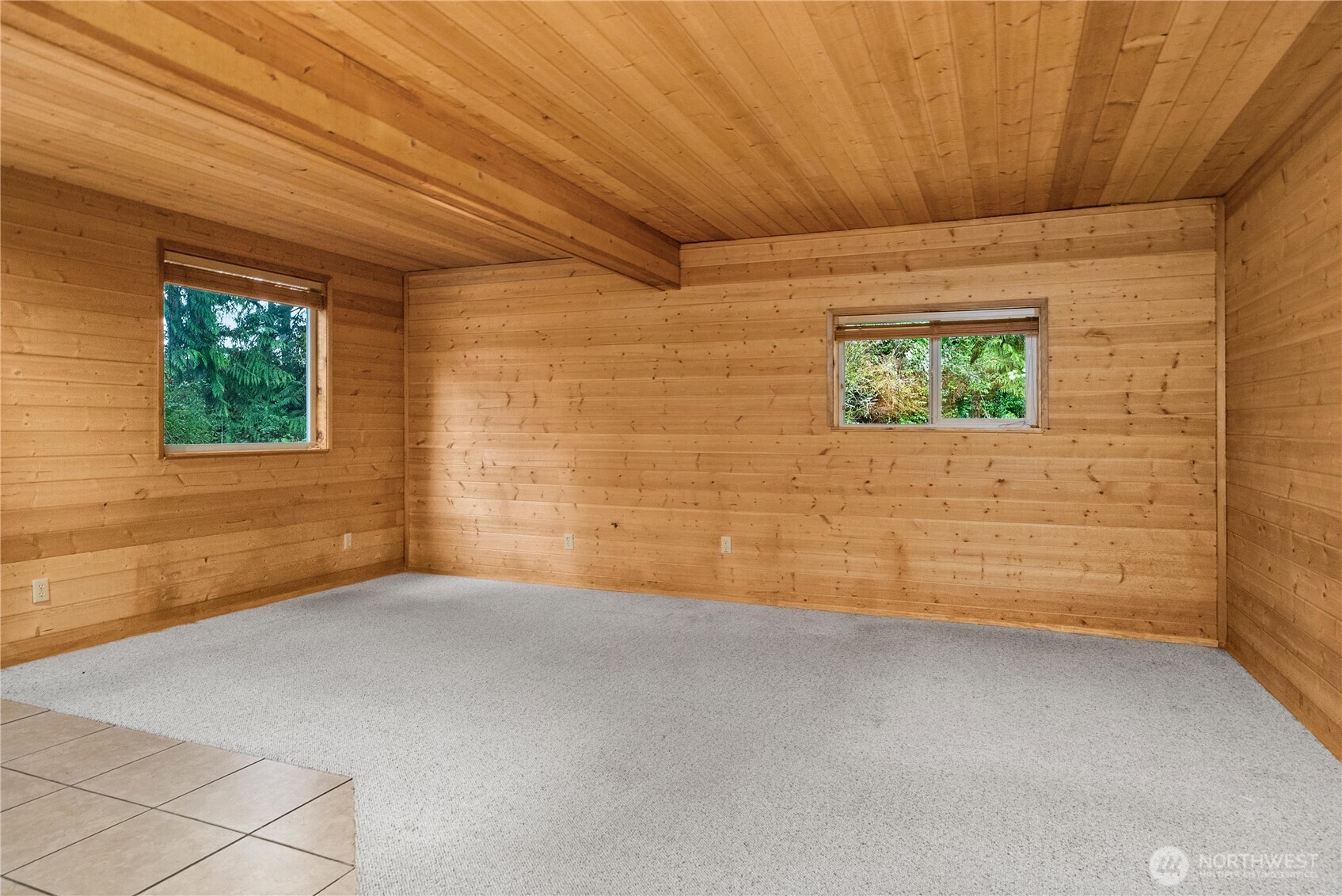 4692 Northeast Lincoln Road Poulsbo, WA 98370 - Photo 3 of 22 a view of an empty room with a window