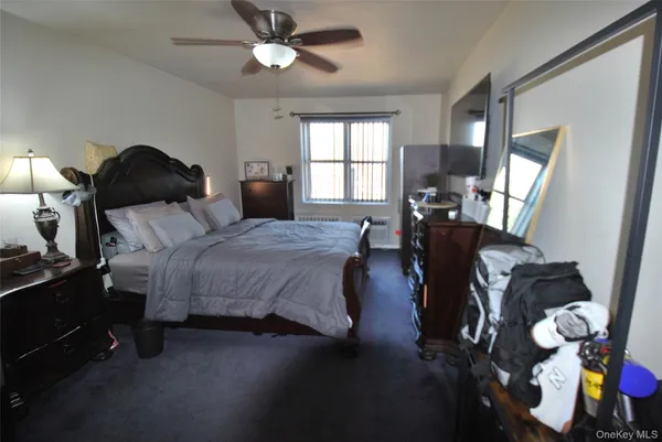 a bedroom with bed and window