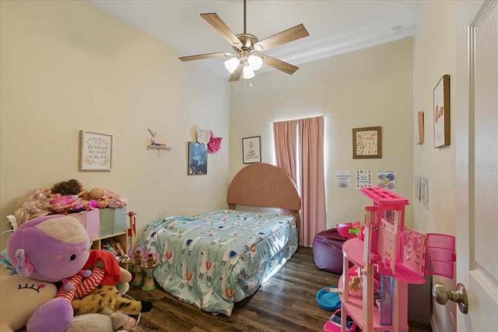 1180 Hough Street Bell, FL 32619 - Photo 13 of 35 a bedroom with furniture and a bed