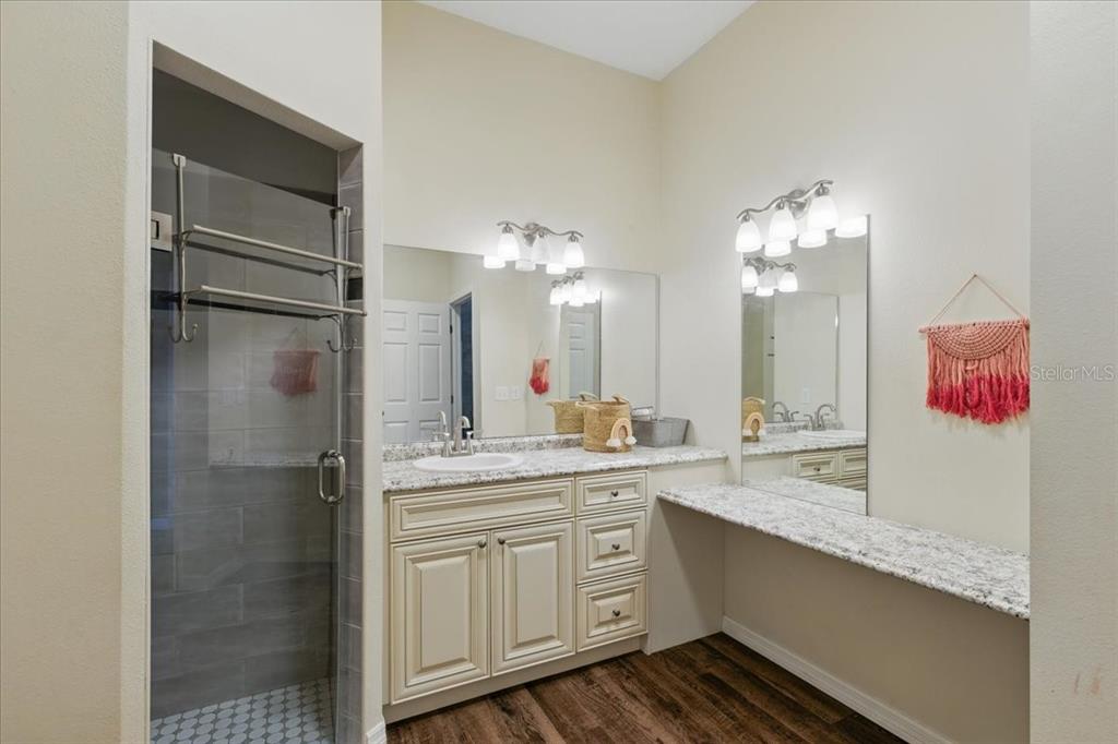 1180 Hough Street Bell, FL 32619 - Photo 14 of 35 a bathroom with a double vanity sink and a mirror