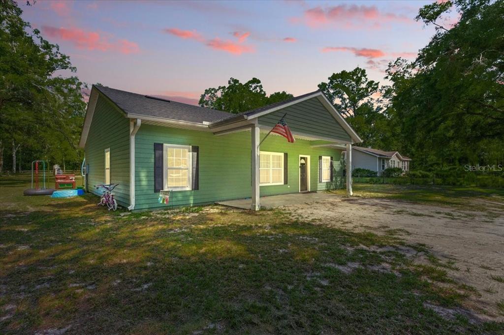 1180 Hough Street Bell, FL 32619 - Photo 17 of 35 a view of a house with a yard