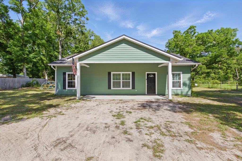 1180 Hough Street Bell, FL 32619 - Photo 18 of 35 a view of a house with a yard