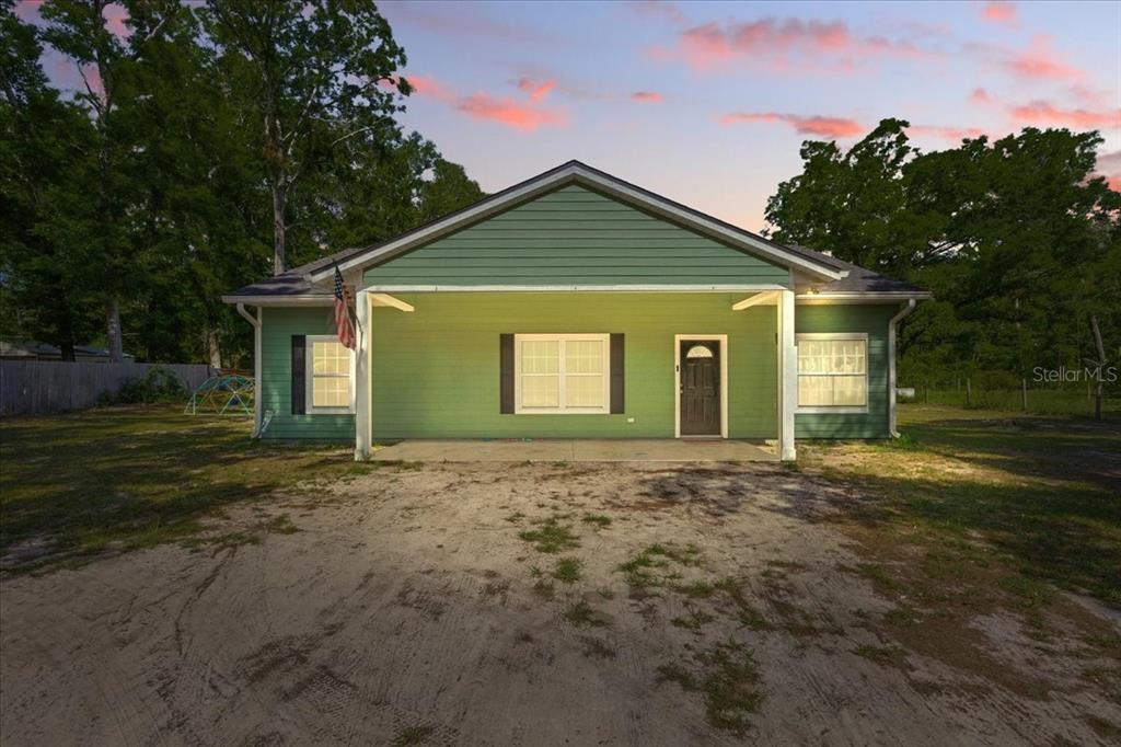 1180 Hough Street Bell, FL 32619 - Photo 23 of 35 a view of a house with a yard