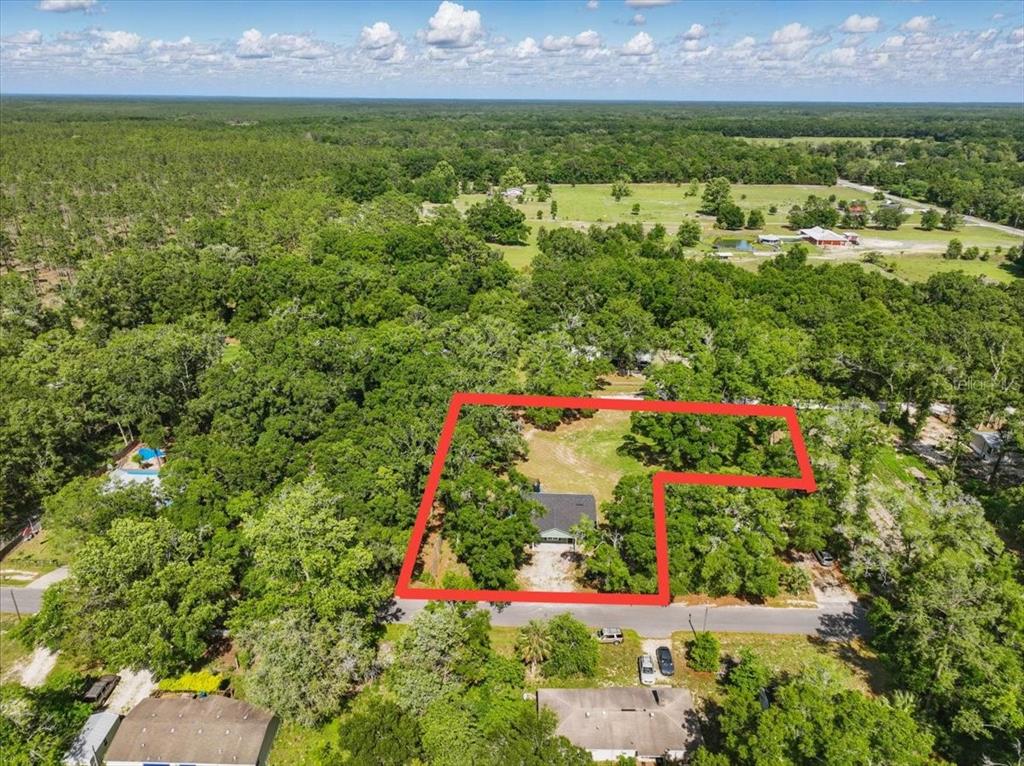 1180 Hough Street Bell, FL 32619 - Photo 25 of 35 an aerial view of residential house with outdoor space and swimming pool
