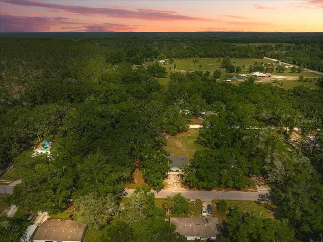 a view of a garden with a building