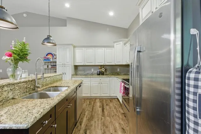 a kitchen with a refrigerator and countertop