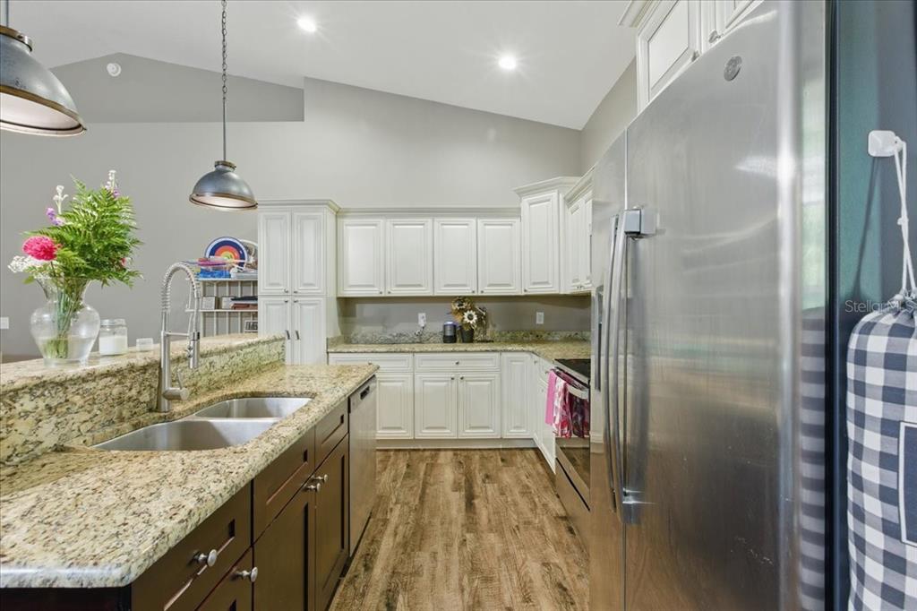 1180 Hough Street Bell, FL 32619 - Photo 4 of 35 a kitchen with a refrigerator and countertop
