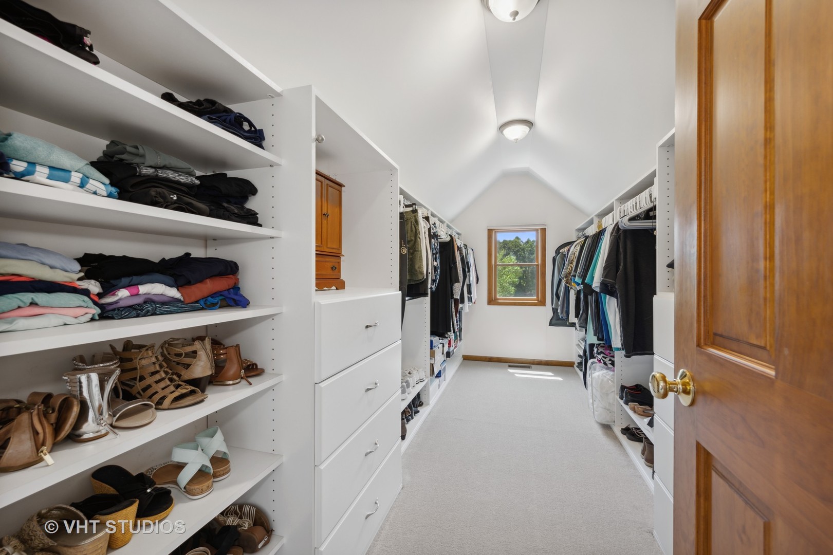 2758 Miller Road Geneva, IL 60134 - Photo 15 of 29 a hallway with lots of different colored cloths