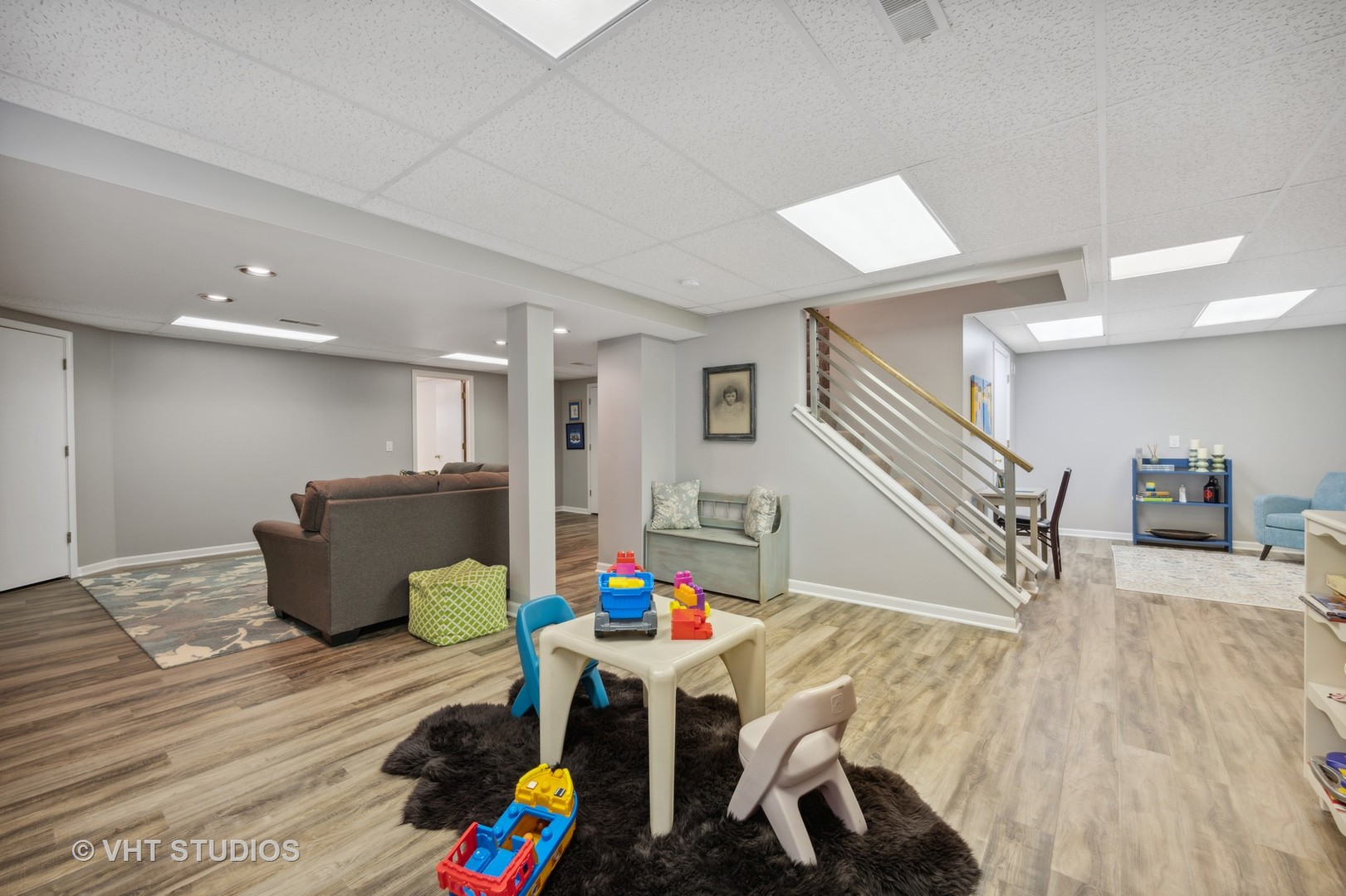 2758 Miller Road Geneva, IL 60134 - Photo 23 of 29 a living room with furniture and stairs with wooden floor