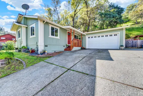 a front view of a house with garage