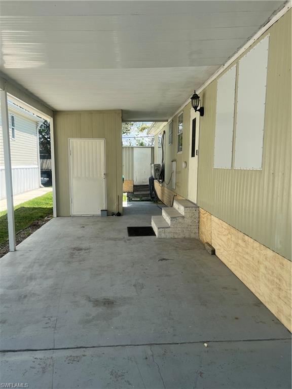 777 Walkerbilt Road, Unit 9 Naples, FL 34110 - Photo 2 of 17 a view of an empty room