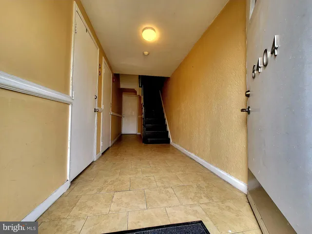 a view of a hallway with staircase